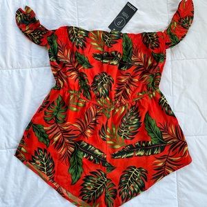 Petite frill sleeve detail tropical print romper
